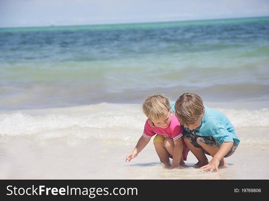 Two children playing in water