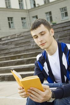 Male Student On Campus With Textbooks Stock Images