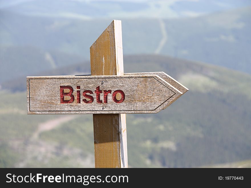 Bistro sign in mountain. Bistro is a small restaurant serving moderately priced simple meals in a modest setting.