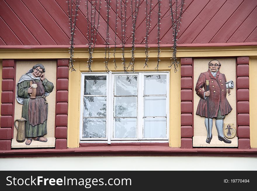 View of the beautifully decorated building in Karpacz, Poland. 

Karpacz is situated in the Karkonosze mountains and  is one of the most important centres for mountain hiking and skiing.