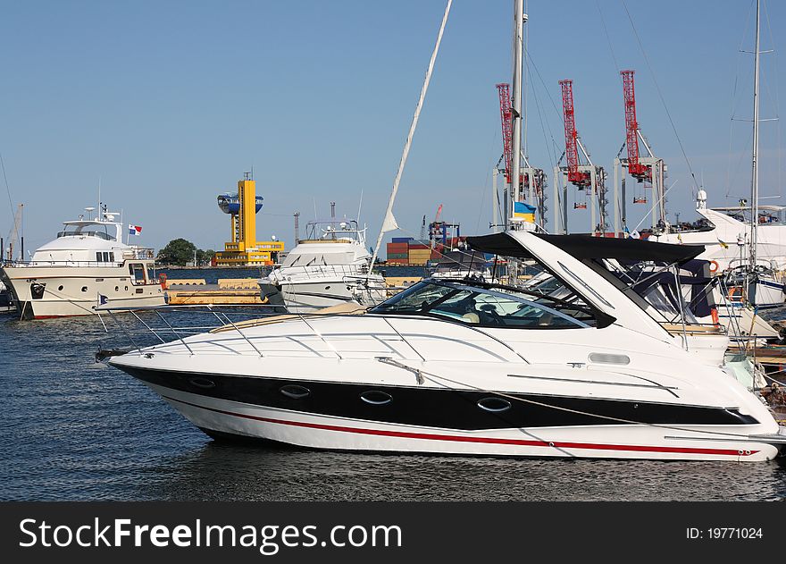 White yachts mooring in marina. White yachts mooring in marina