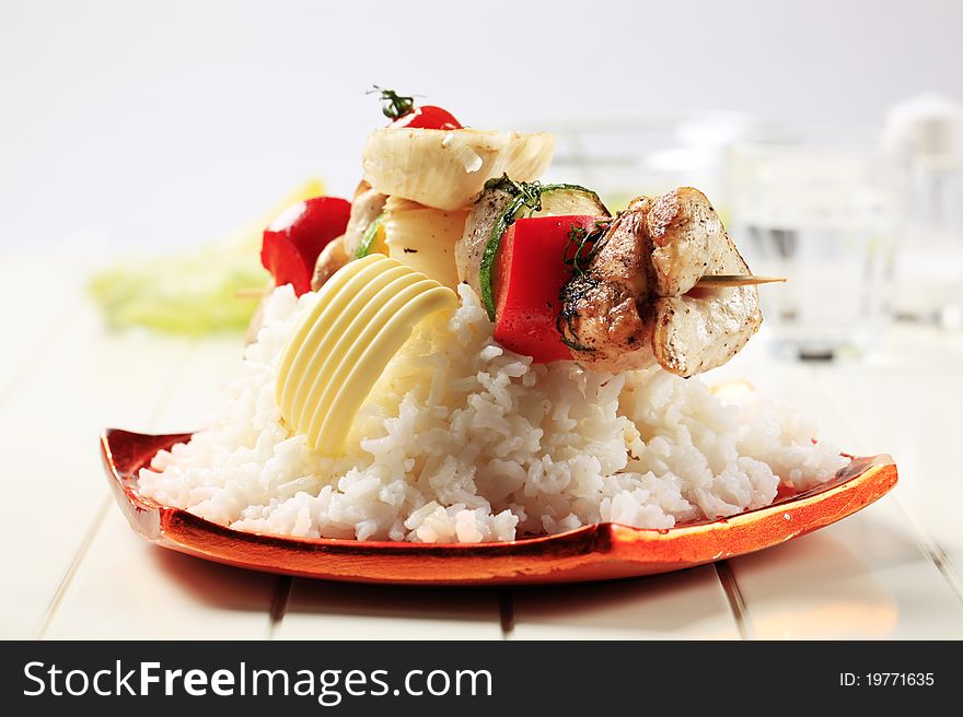 Chicken shish kebab on bed of white rice. Chicken shish kebab on bed of white rice