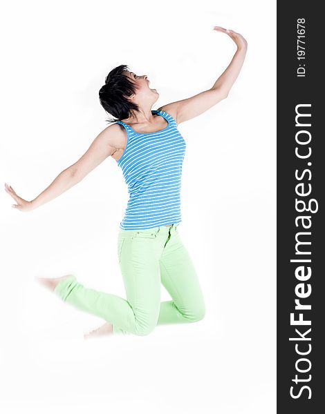 Jumping Happy Girl in green pants Isolated on White. Jumping Happy Girl in green pants Isolated on White