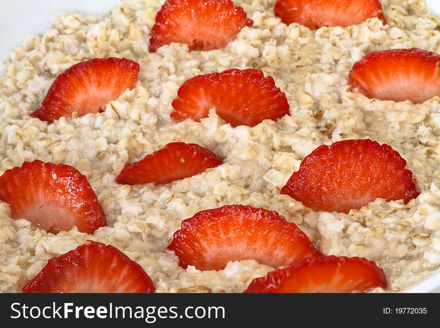 Bowl of oatmeal with strawberries