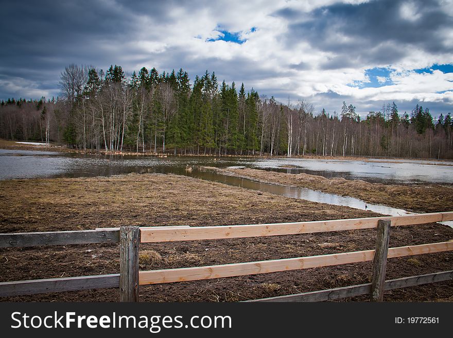 A wooden fence on a field in Sweden