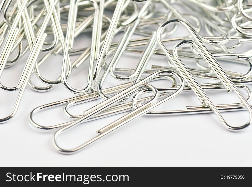 Close up pile of metal clip on bright background. Close up pile of metal clip on bright background