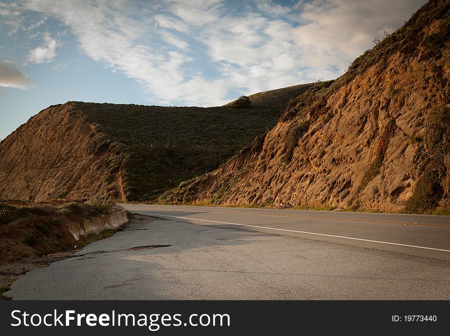 Photo of a mountain and the road on the freeway #1 from San Francisco to Palo Alto in the state of California. Photo of a mountain and the road on the freeway #1 from San Francisco to Palo Alto in the state of California.