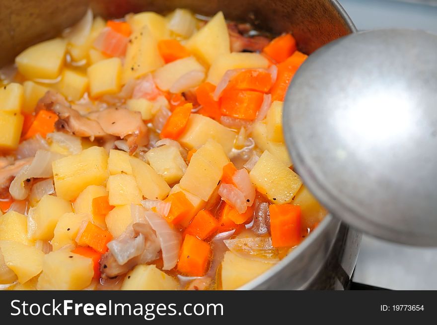 Asian style potato and carrot stew cooked in pot. Asian style potato and carrot stew cooked in pot.