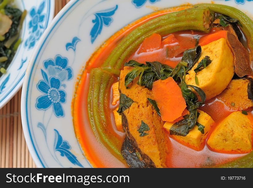 Traditional Chinese style curry prepared with fish and healthy vegetables. Traditional Chinese style curry prepared with fish and healthy vegetables.