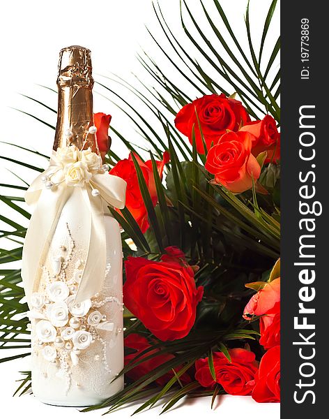 Red roses and champagne isolated on white.