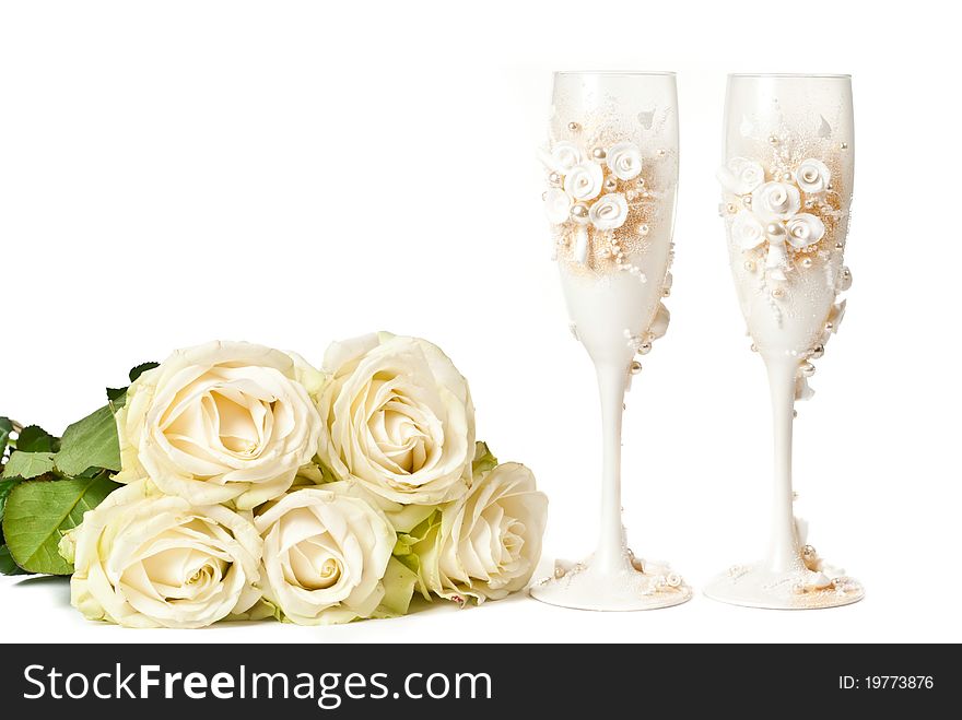 Two empty glasses with roses on white background. Two empty glasses with roses on white background