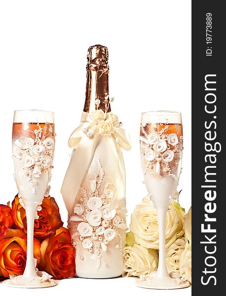 Two glasses of champagne and a roses against white background. Two glasses of champagne and a roses against white background.