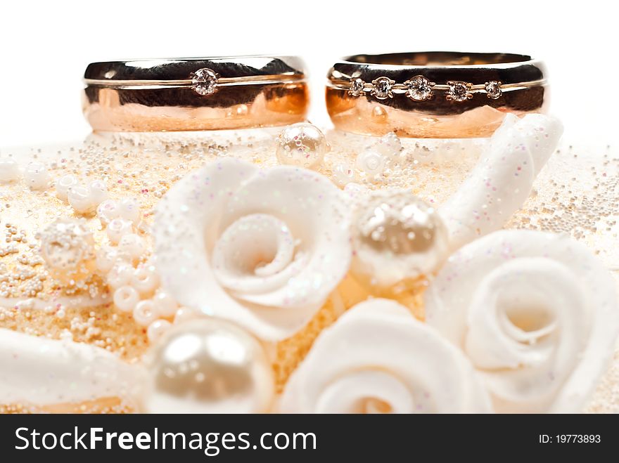 Pair of golden wedding rings. Isolated on white