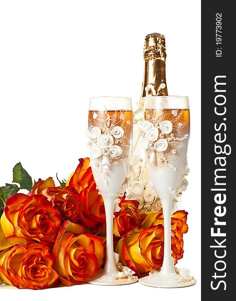 Two glasses of champagne and a roses against white background. Two glasses of champagne and a roses against white background.