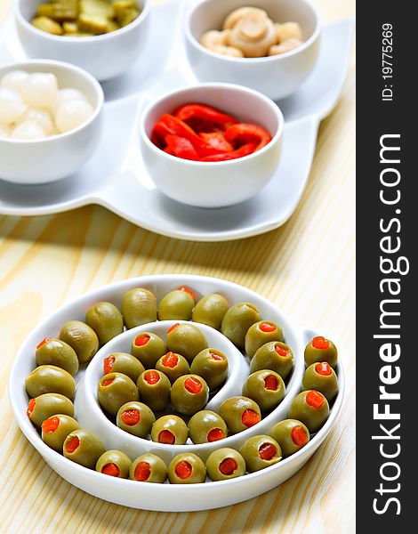 Stuffed green olives on ceramic plate