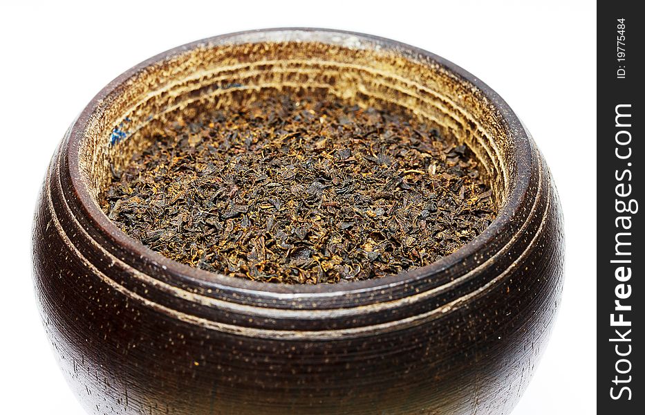 Black Tea Isolated On White In Wooden Bowl