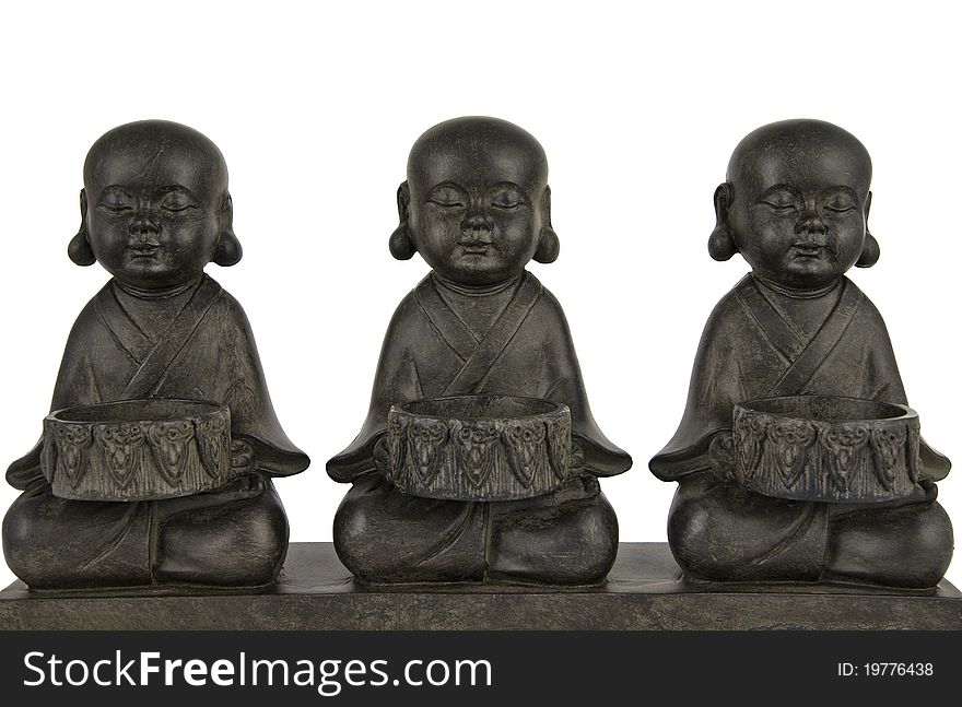 Sculpture with three Buddha in lotus position. Sculpture with three Buddha in lotus position