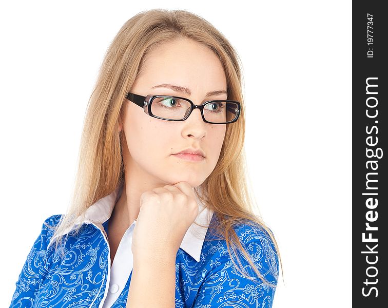 Young business woman in glasses sitting thinking. Young business woman in glasses sitting thinking