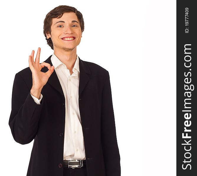 Young business man standing smiling and showing okay gesture on white background. Young business man standing smiling and showing okay gesture on white background