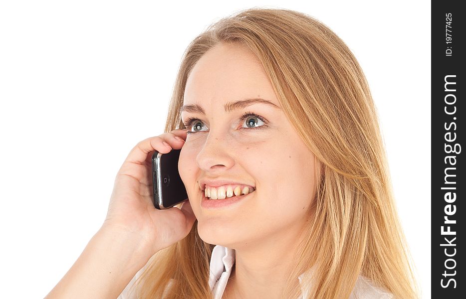 Young business woman smiling and holding phone looking up