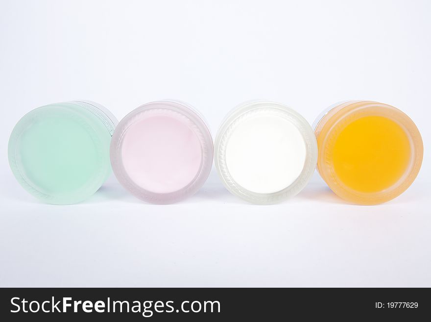 Four pot of cosmetic cream, colorful. Four pot of cosmetic cream, colorful.