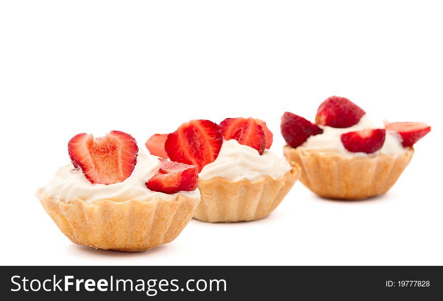 Strawberries and cream in a basket on a white background