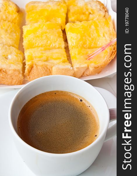 Breakfast with coffee and bread on the table