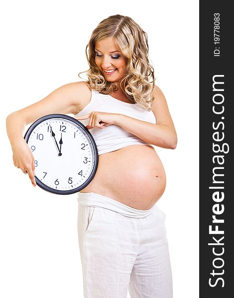 Pregnant woman with clock isolated on white