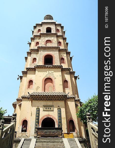 Bottom view of an ancient Chinese pagoda against blue sky. Bottom view of an ancient Chinese pagoda against blue sky