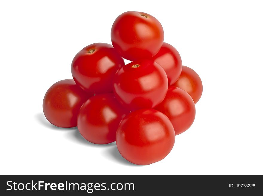 Pyramid is built of small red cherry tomatoes isolated