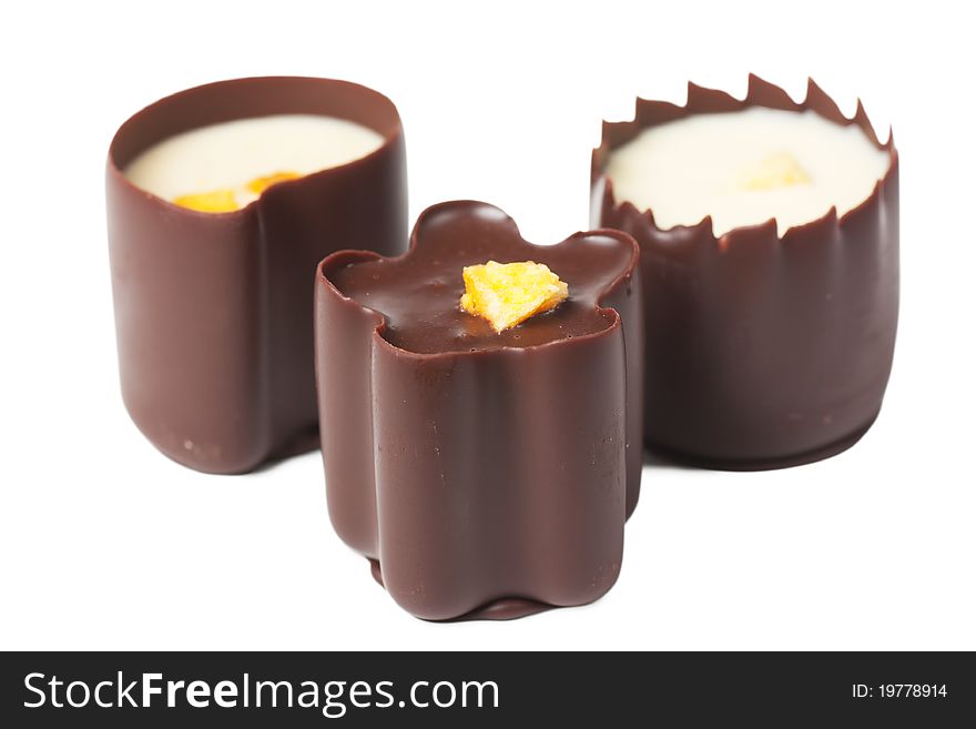 Closeup view of chocolate candies over white background