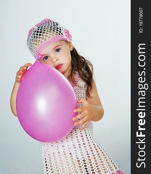 Small child with colorful balloons in the studio. Small child with colorful balloons in the studio