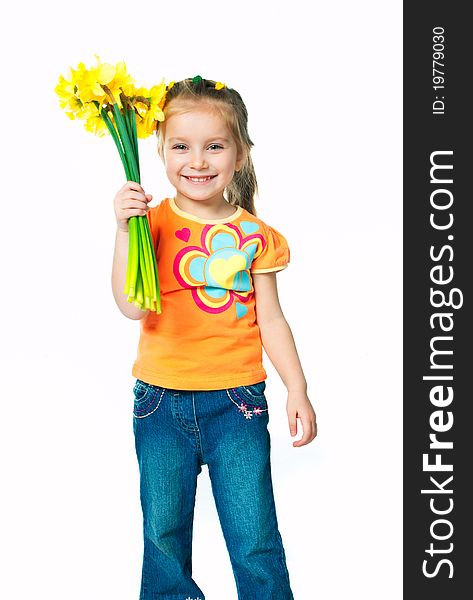 Little beautiful girl with a bouquet of daffodils. Little beautiful girl with a bouquet of daffodils