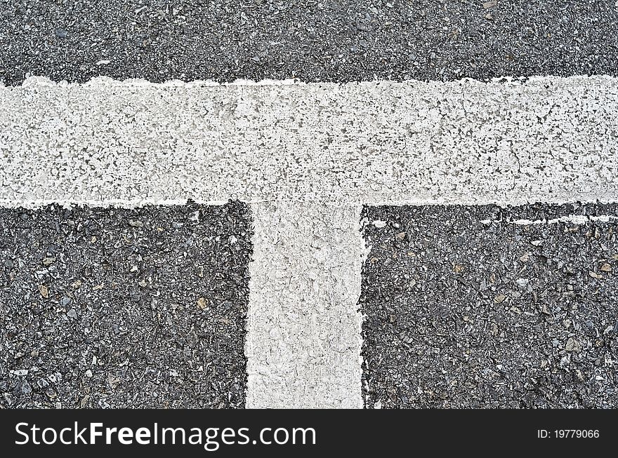 Closeup of a tar or asphalt pavement texture with a white line painted. Closeup of a tar or asphalt pavement texture with a white line painted