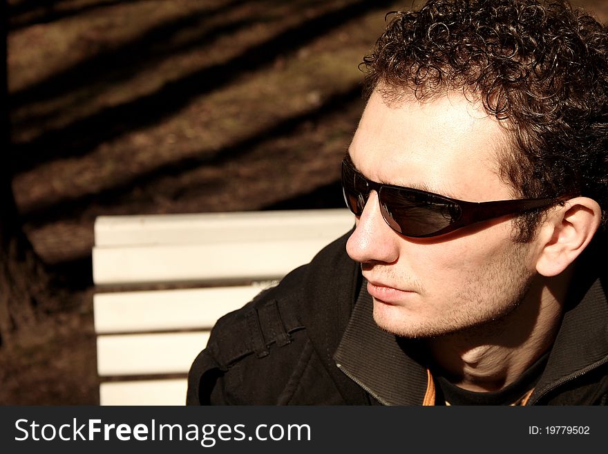 Outdoor portrait of young handsome man with sunglasses
