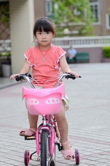 Asian Child Riding A Bicycle Stock Photography Asian Child Riding A Bicycle Stock Photography