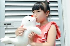 Asian Child Kiss The Dolphin Stock Photography