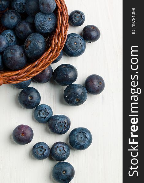 Fresh blueberries on white wooden table