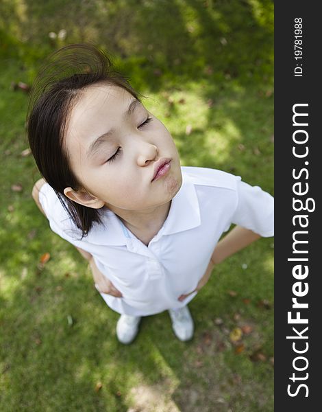 10-year old asian girl, shot from above with wide angle lens. 10-year old asian girl, shot from above with wide angle lens.