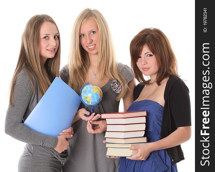 Young smiling students with books on white