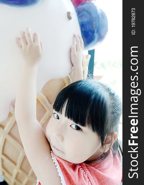 Bright picture of adorable chinese girl and ice cream. Bright picture of adorable chinese girl and ice cream