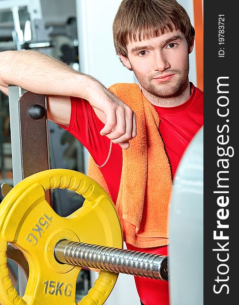 Handsome young man in the gym centre. Handsome young man in the gym centre.