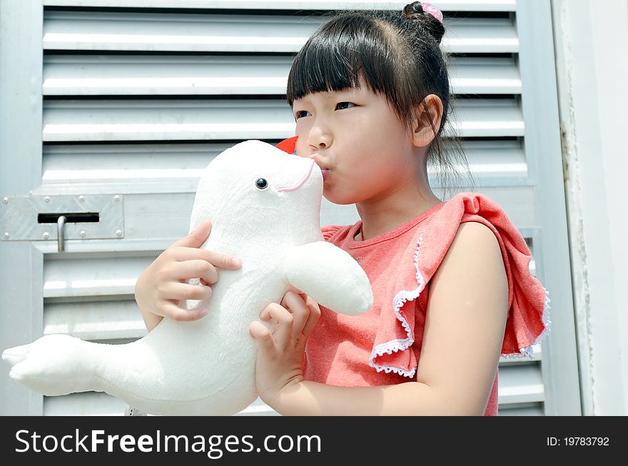 Asian child kiss the Dolphin