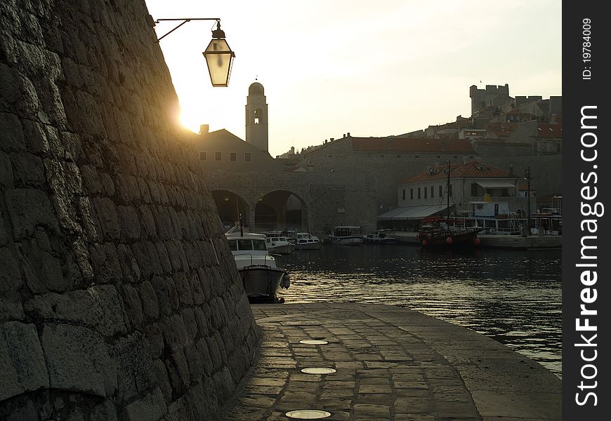 Dubrovnik old city harbor view at dusk. Dubrovnik old city harbor view at dusk