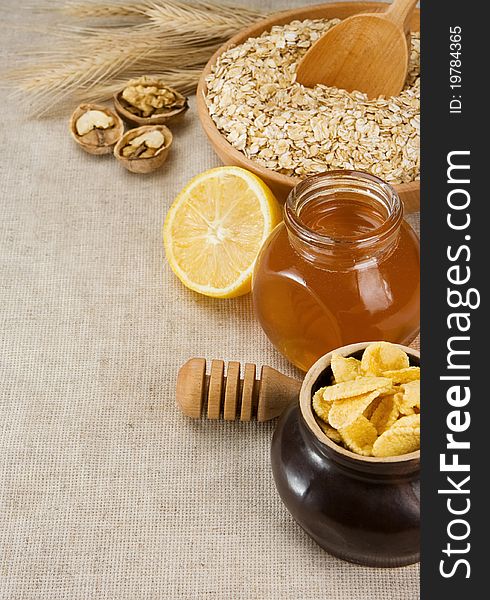 Plate Of Oat, Honey And Healthy Food On Sack