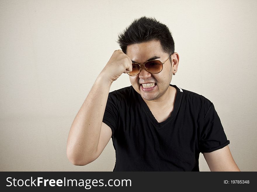 A man wearing sunglasses with expression pose, confident. A man wearing sunglasses with expression pose, confident.