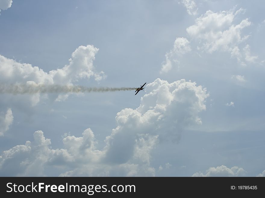 Flight of an aircraft on a blue sky with white clouds, raw. Flight of an aircraft on a blue sky with white clouds, raw