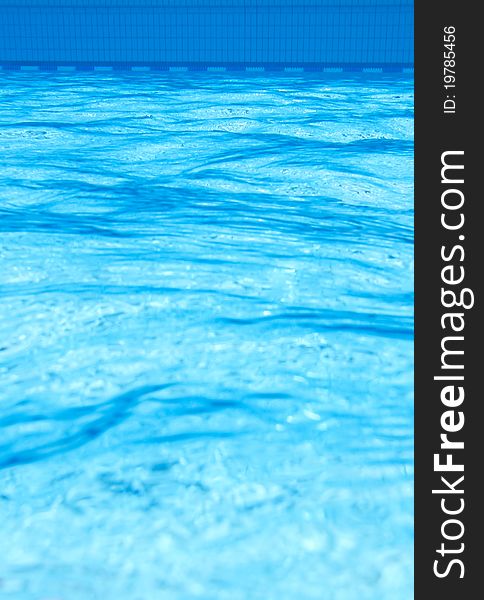 Ripples in blue pool in under water view