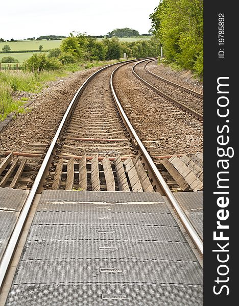 Railway lines in the country side curving in the distance. Railway lines in the country side curving in the distance