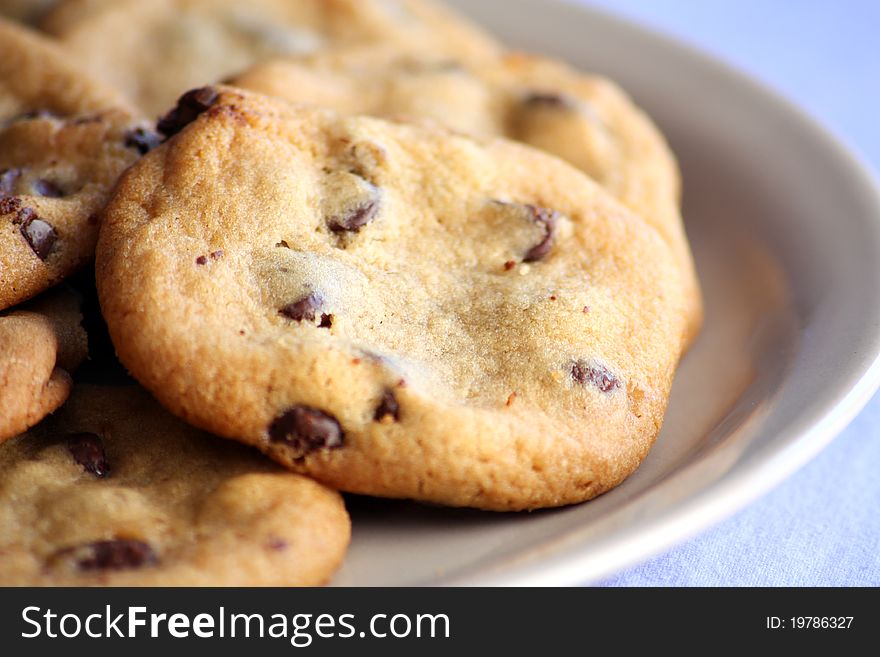 Chocolate chip cookies served on a plate.